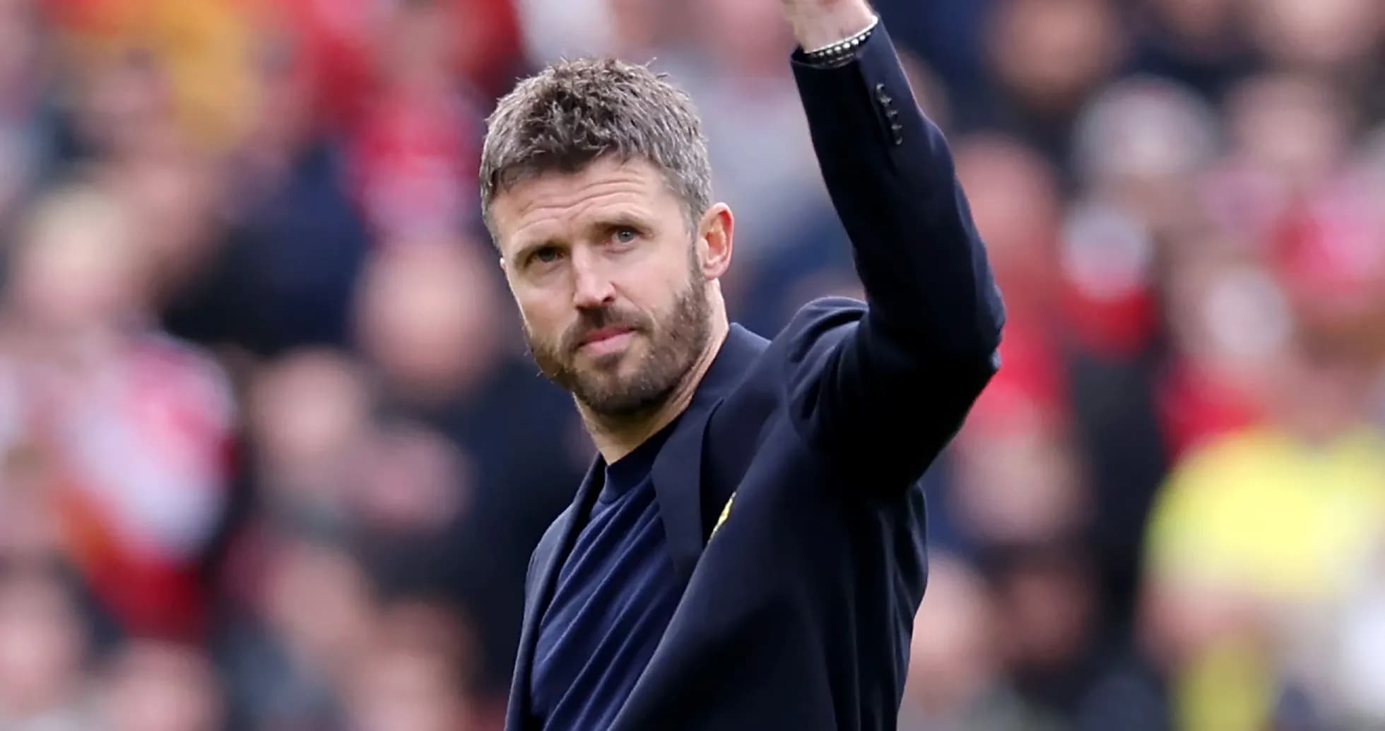 Manager waving to fans during match event
