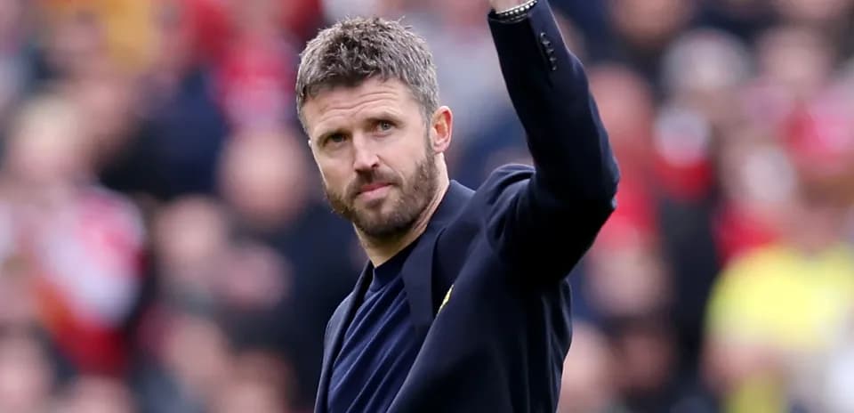 Manager waving to fans during match event