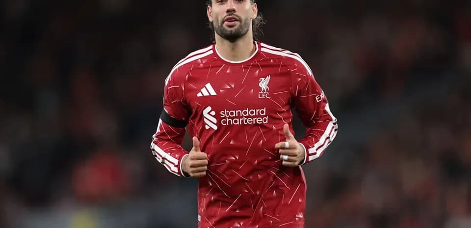 Player warming up in Liverpool training kit