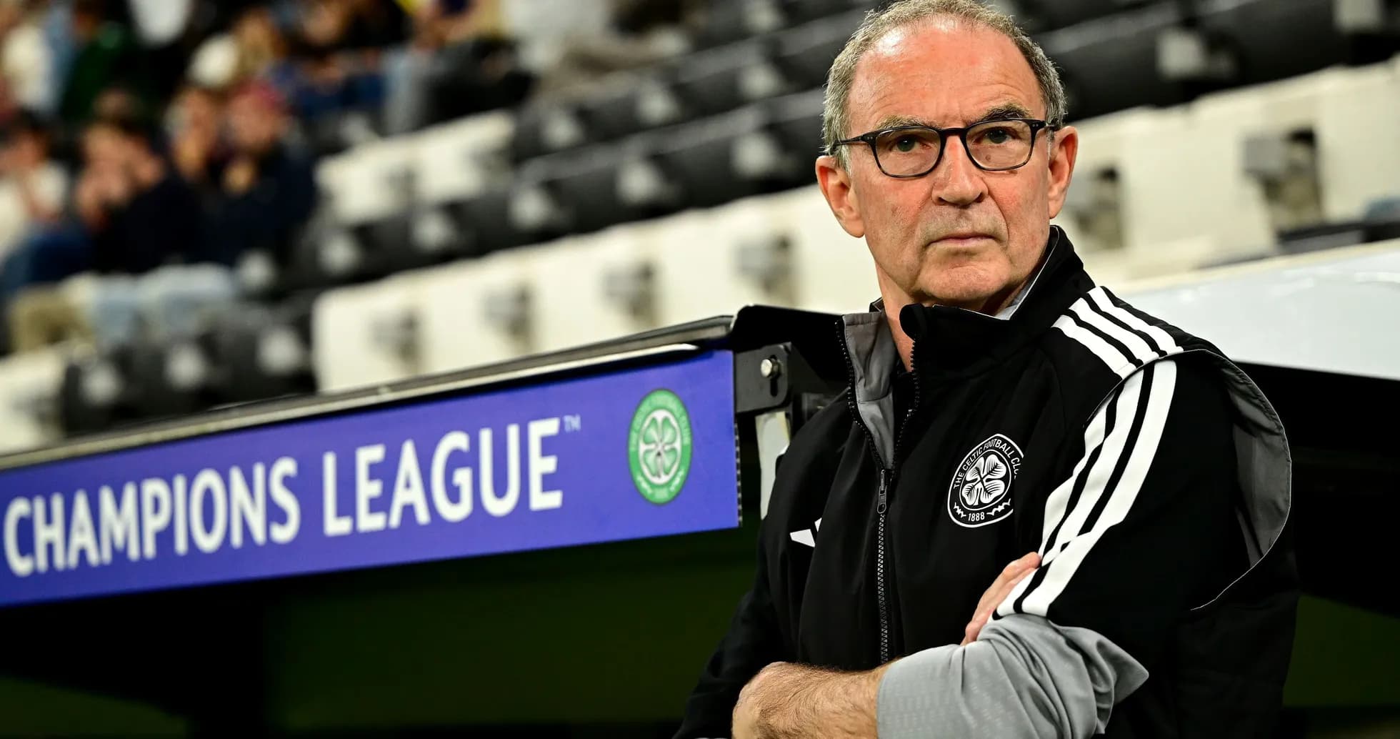 Coach observing match from the sidelines in stadium