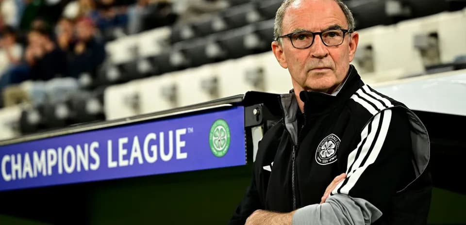 Coach observing match from the sidelines in stadium