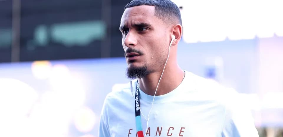 Player wearing headphones walking in casual attire
