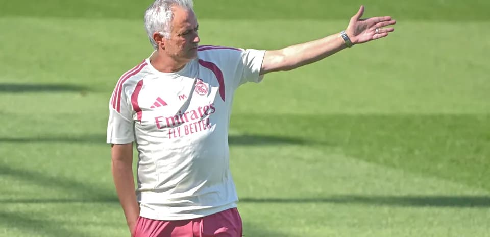 Coach directing players during training session