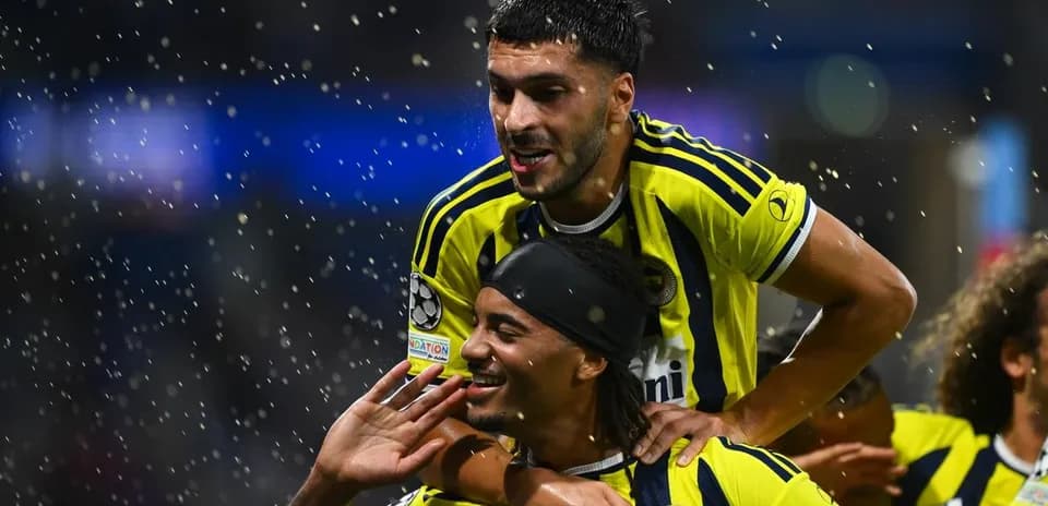 Fenerbahçe players celebrating a goal in UEFA match