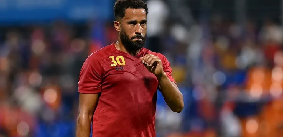 Player in red jersey during match action