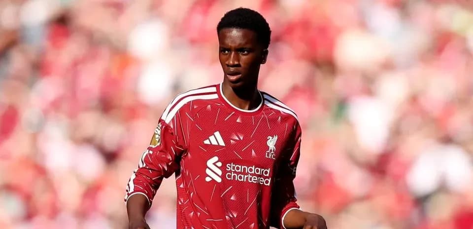 Player in red Liverpool kit on the field