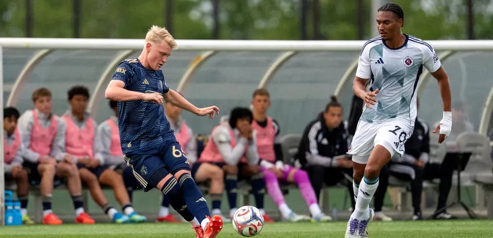 Player kicking the ball during New England II match