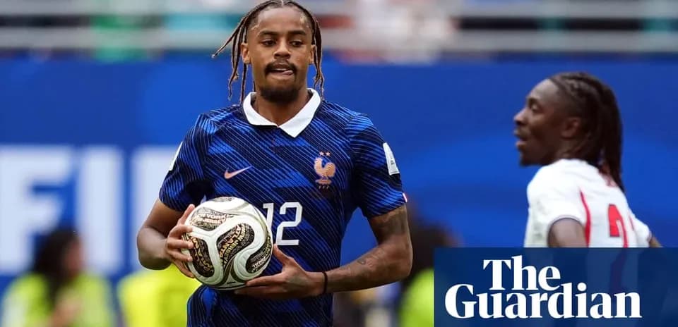 Player in blue France kit holding a soccer ball