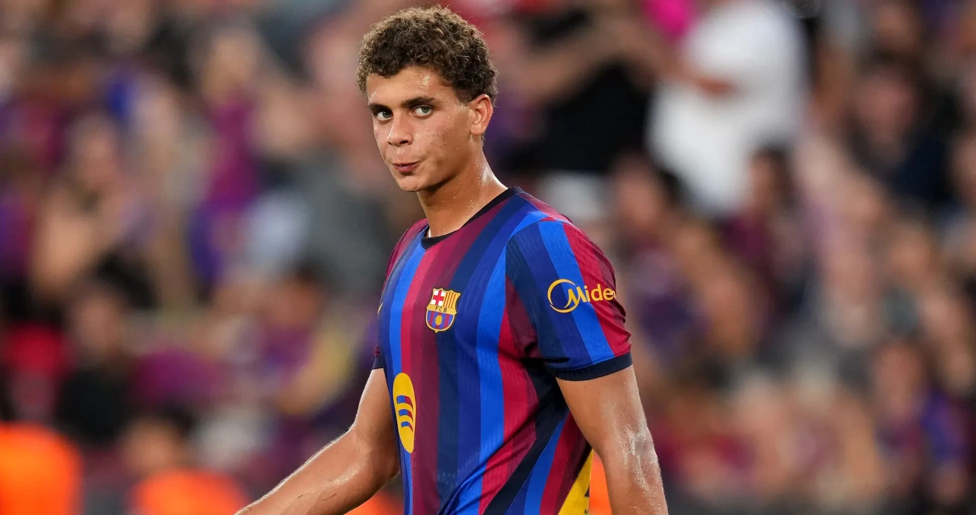 Player in FC Barcelona jersey on the field