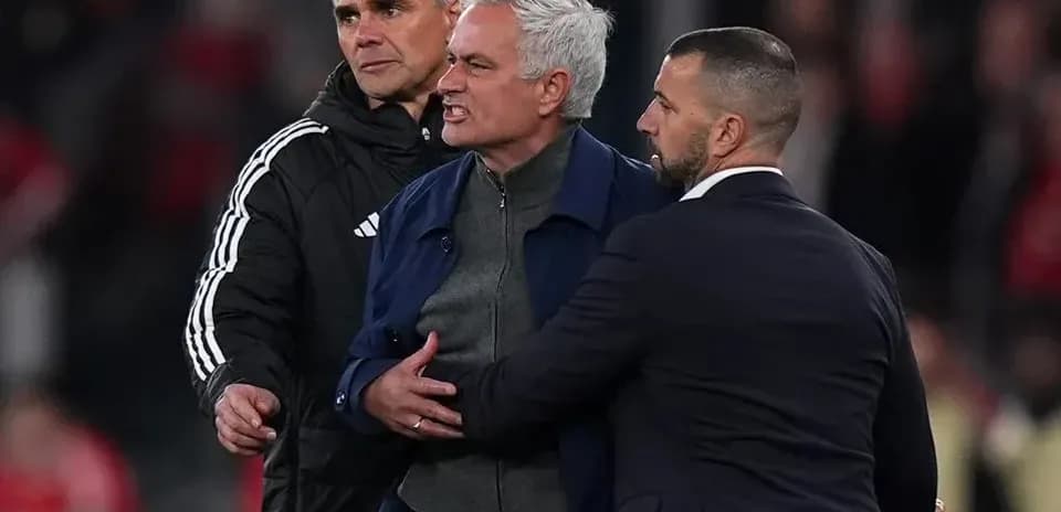 Manager being restrained by staff during heated moment