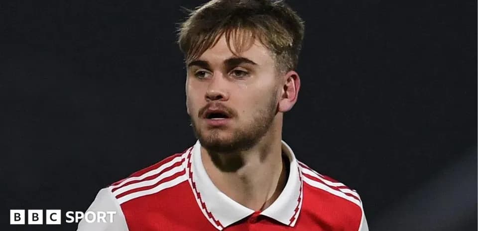 Player wearing Arsenal jersey during a match