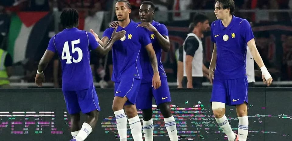 Players celebrating a goal during a football match