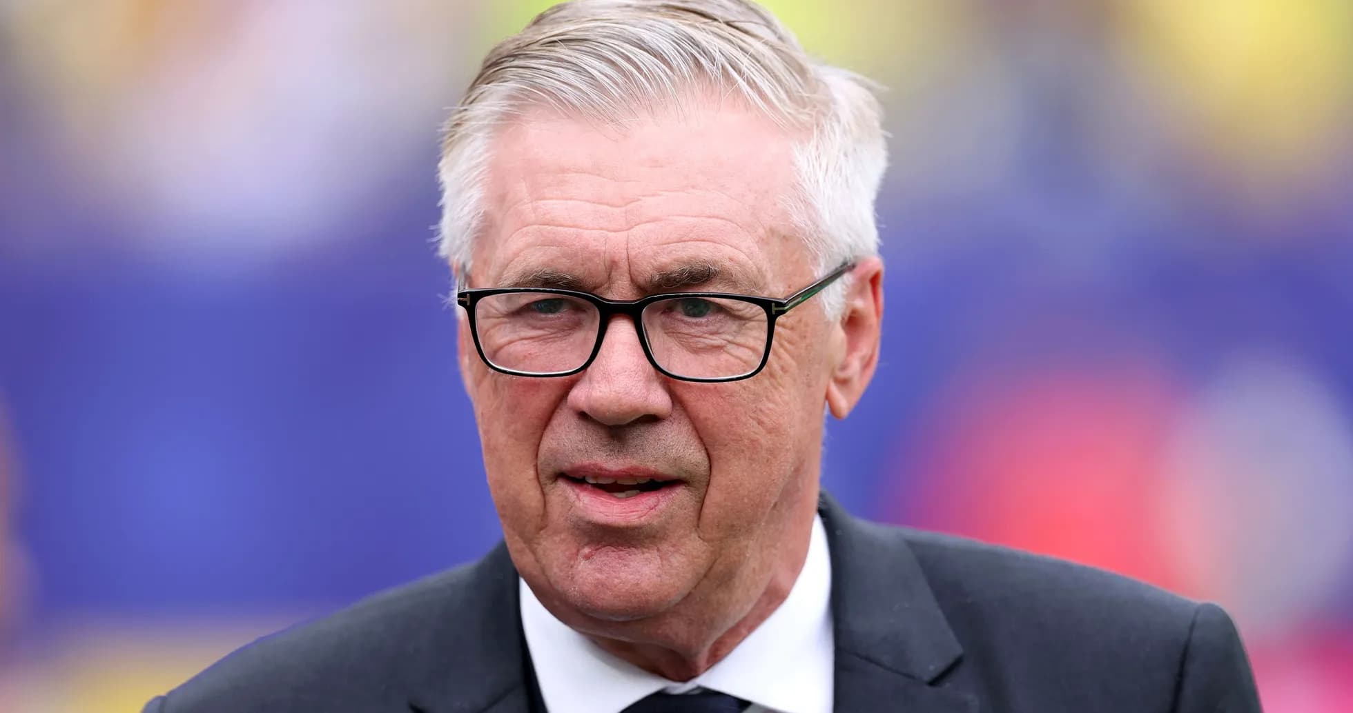 Man in glasses wearing a suit, close-up portrait