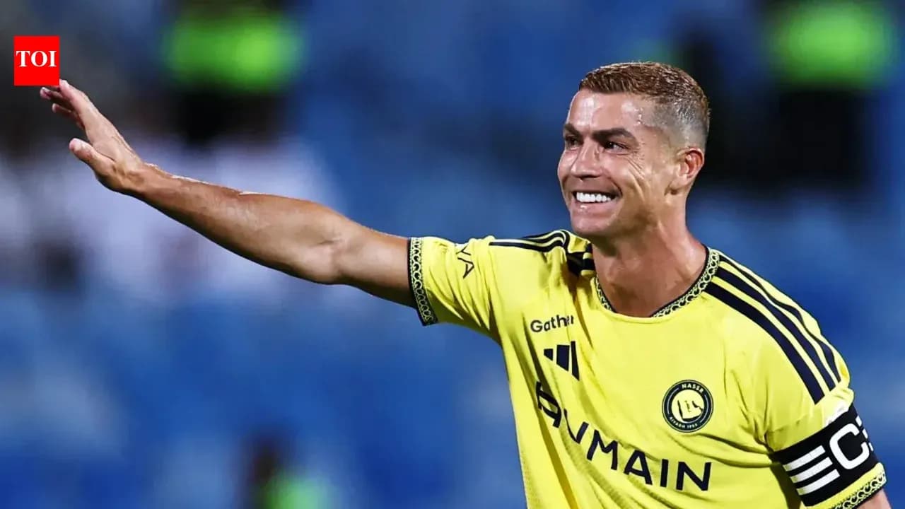 Player celebrating and waving to fans on field