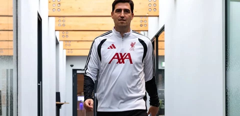 Goalkeeper walking in training facility hallway