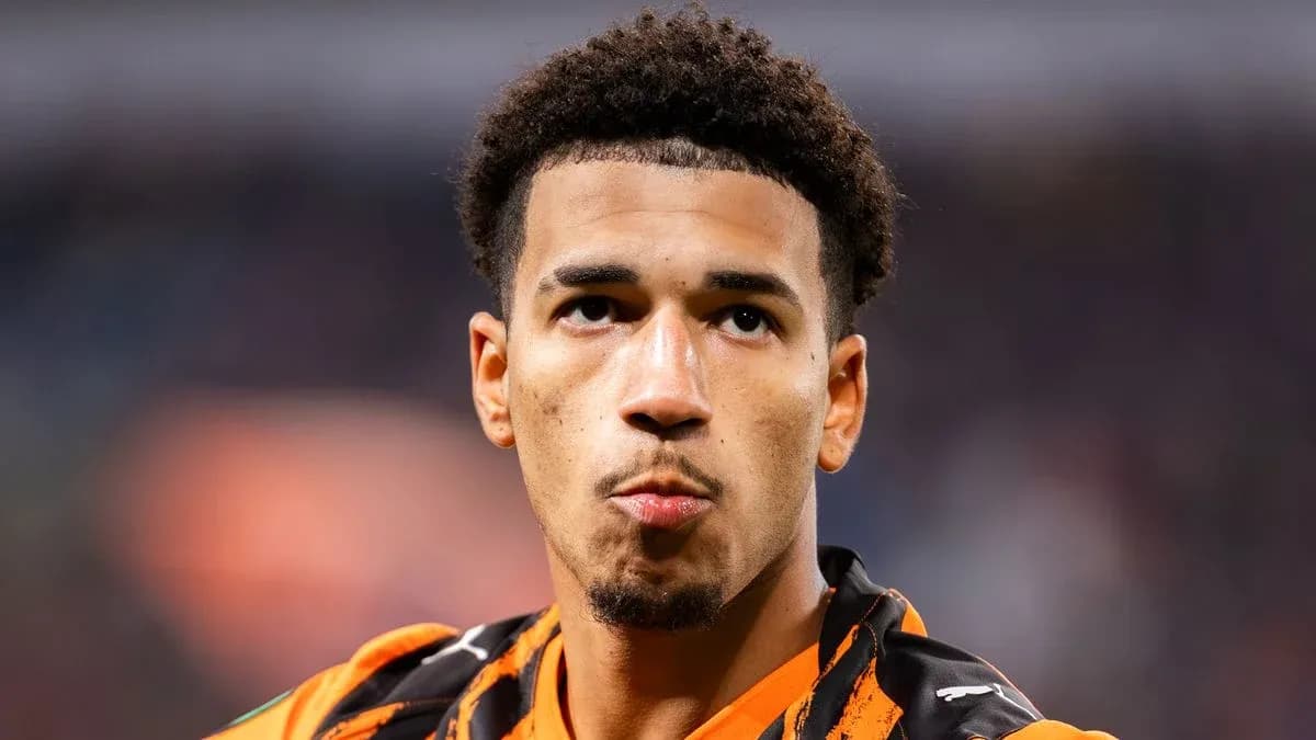 Player in orange jersey during match close-up
