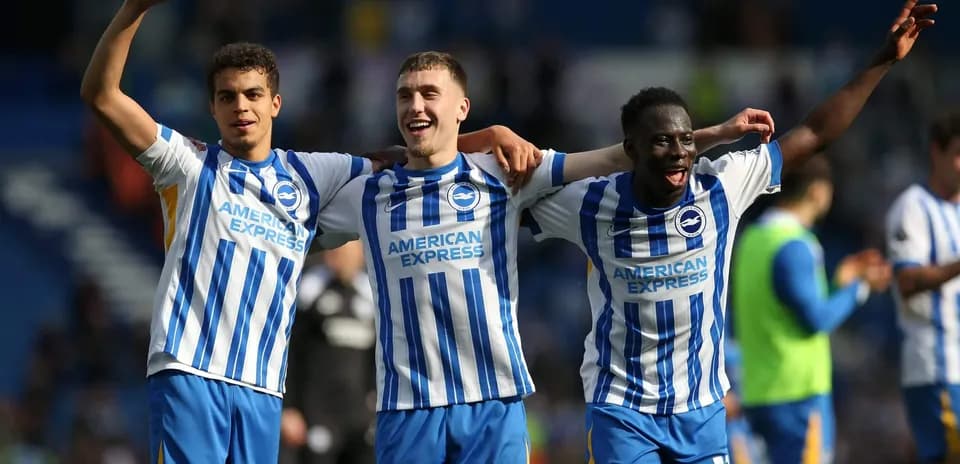 Brighton players celebrating together after match