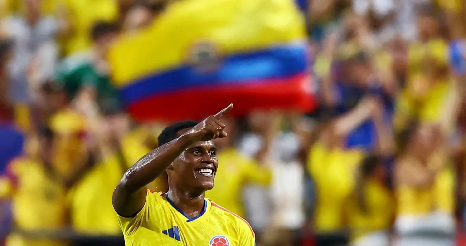 Colombian player celebrating in front of fans