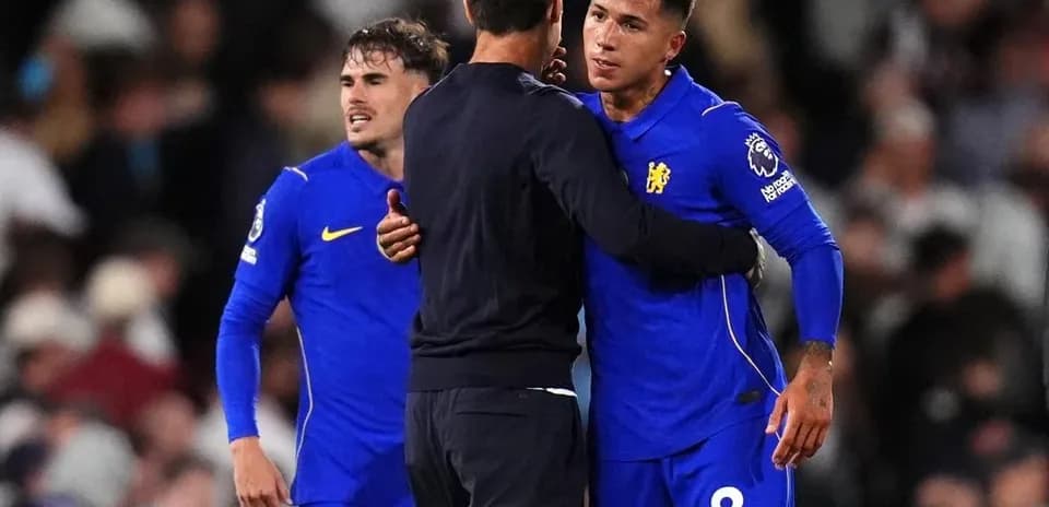 Chelsea players interacting with coach after match
