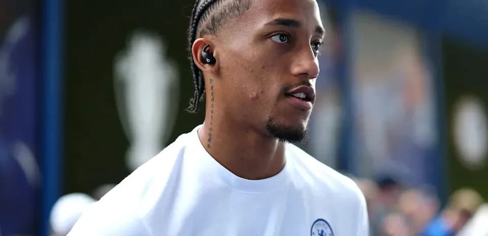 Player wearing Chelsea kit with earbuds