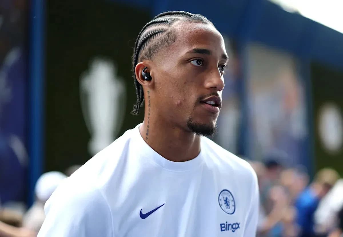 Player wearing Chelsea kit with earbuds