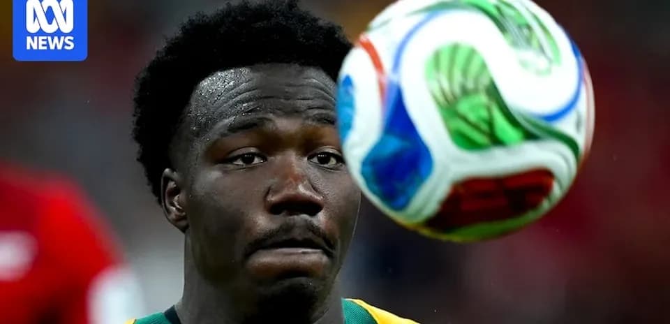 Player focused on approaching soccer ball during match