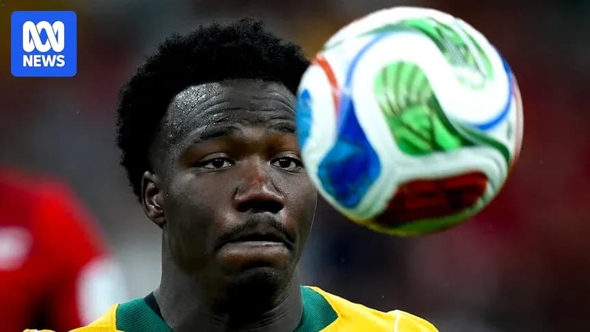 Player focused on approaching soccer ball during match