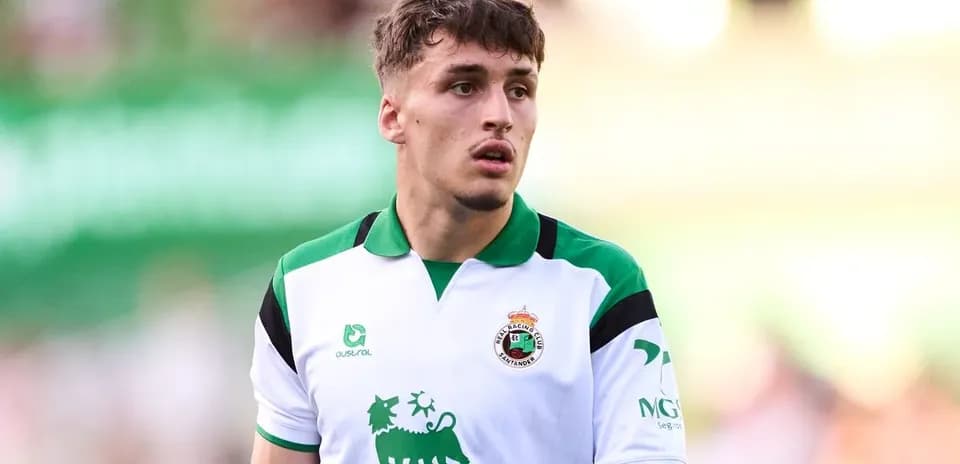 Player in white and green jersey on field