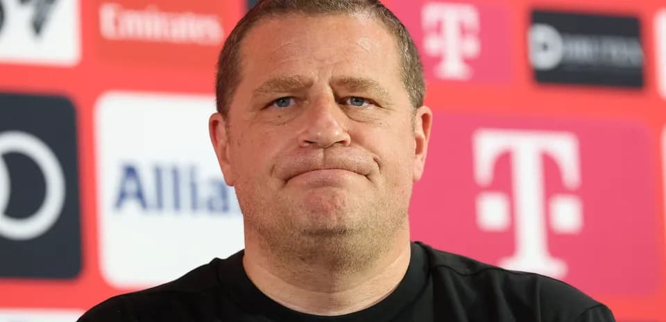 Manager at press conference with branded backdrop