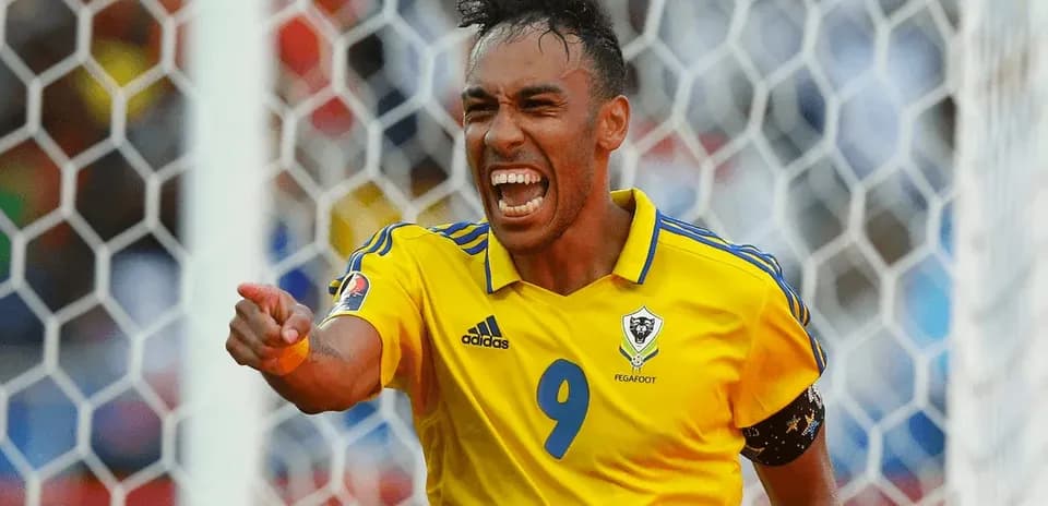 Player celebrating a goal in yellow jersey