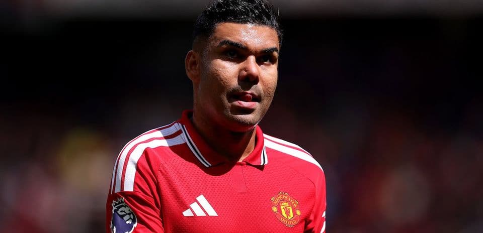 Player in Manchester United jersey on the pitch
