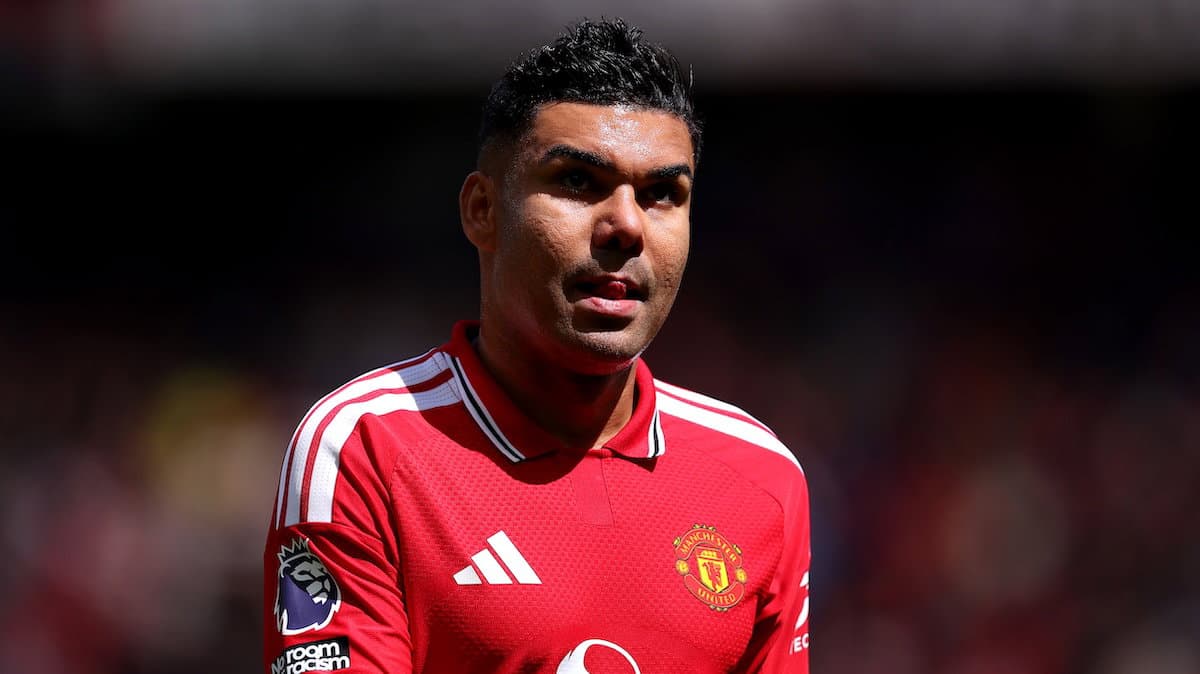 Player in Manchester United jersey on the pitch