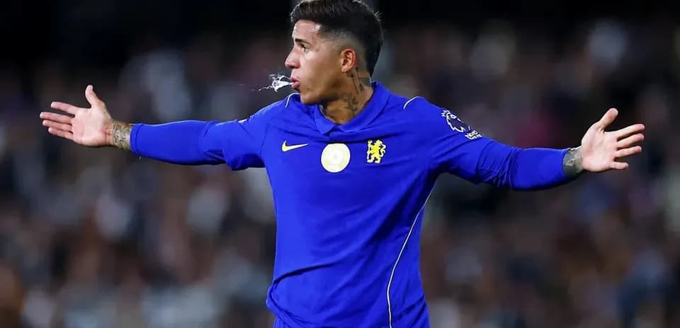 Player gesturing during match in blue Chelsea kit