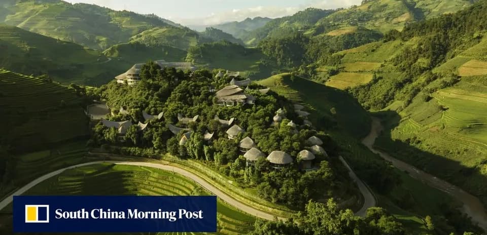 Aerial view of terraced fields and buildings in mountains