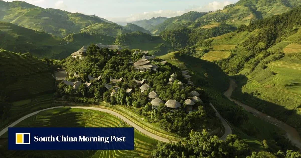 Aerial view of terraced fields and buildings in mountains