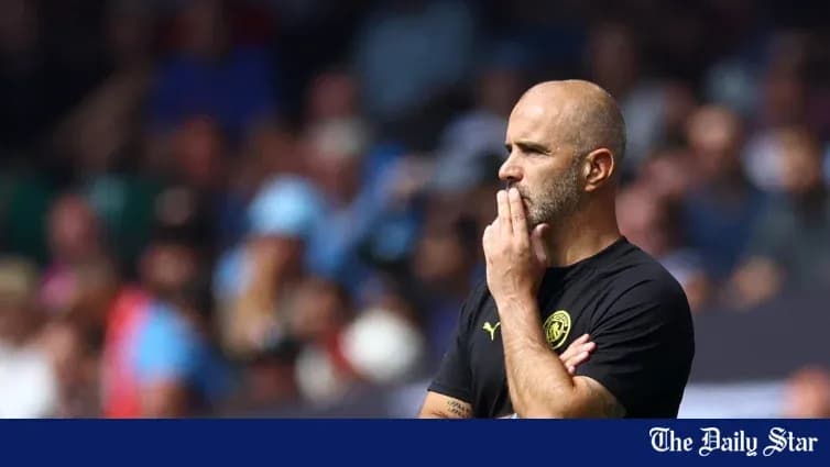 Manager observing the match with thoughtful expression