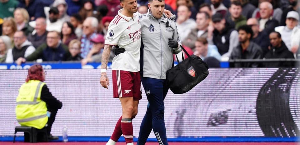 Player receiving assistance from staff after injury