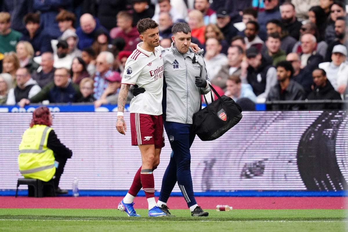 Player receiving assistance from staff after injury
