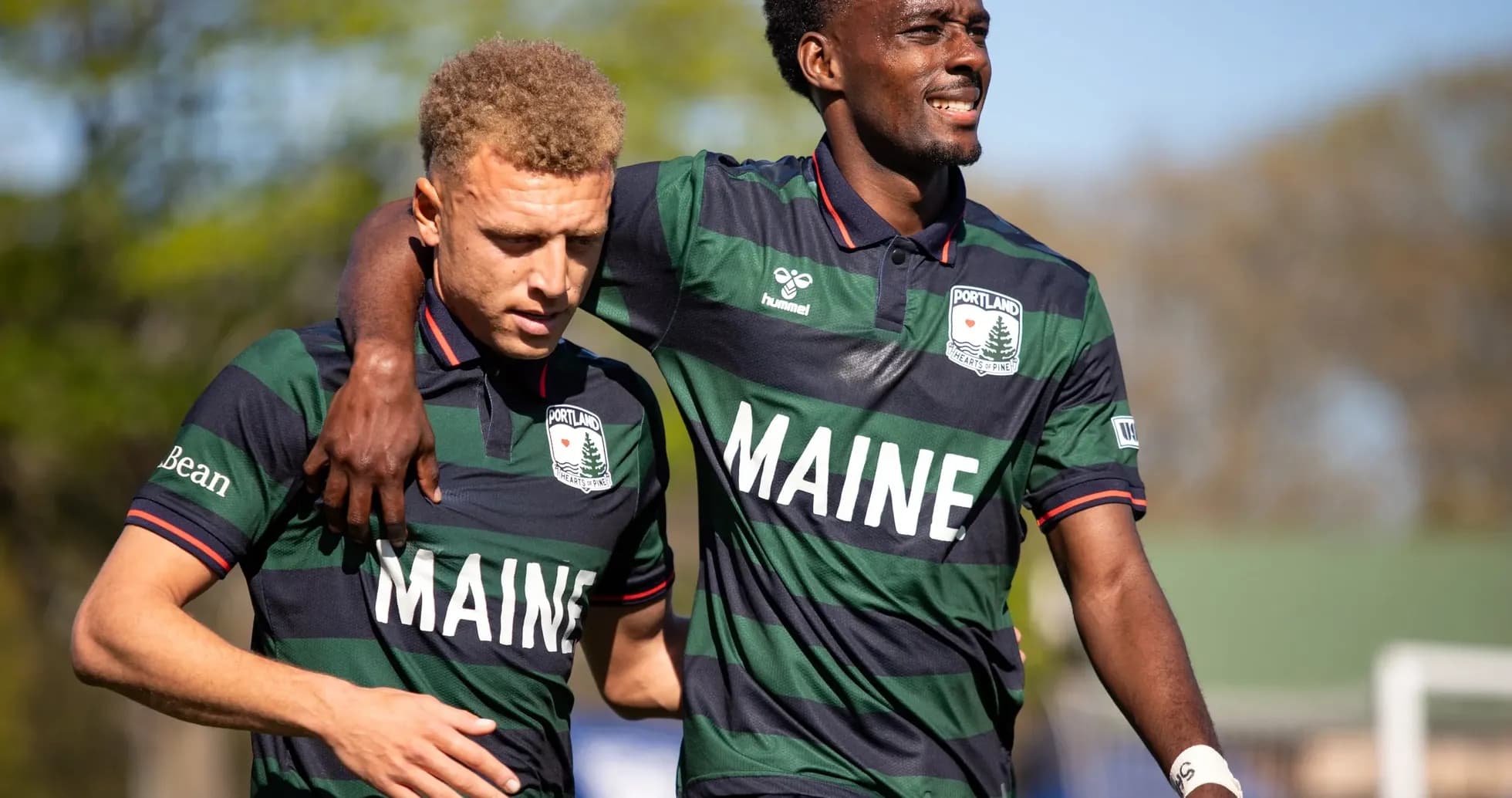 Two Portland Hearts of Pine players celebrating together