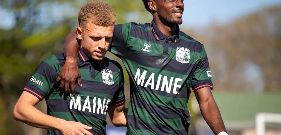 Two Portland Hearts of Pine players celebrating together