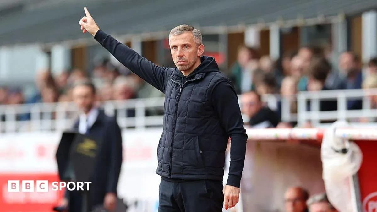 Coach signaling from the sidelines during a match