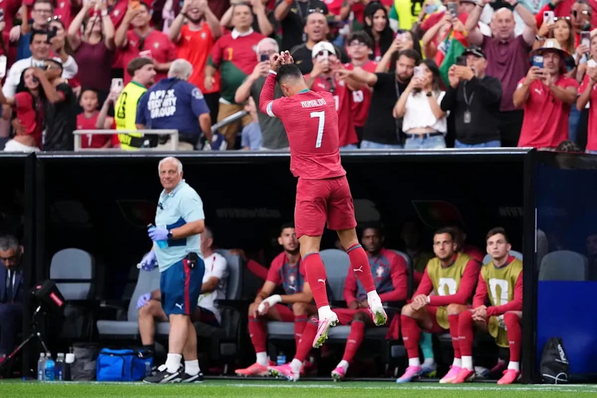 Cristiano Ronaldo celebrating with fans in stadium