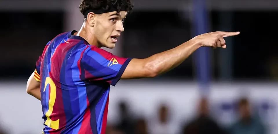Player gesturing during a match in Barcelona kit