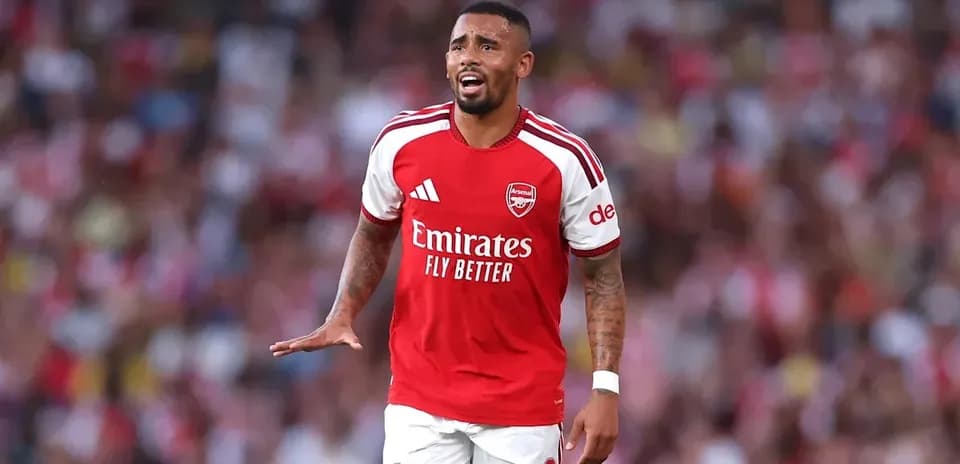 Player in Arsenal kit reacting during a match