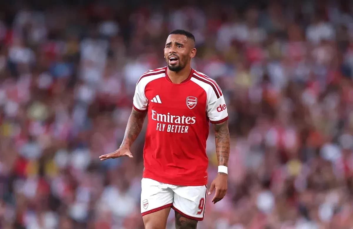 Player in Arsenal kit reacting during a match