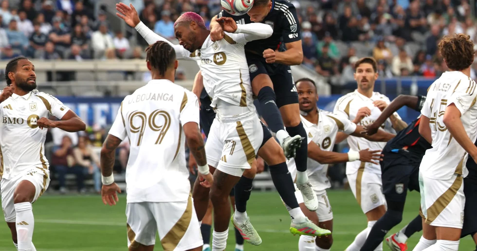 Players competing for the ball during LAFC match