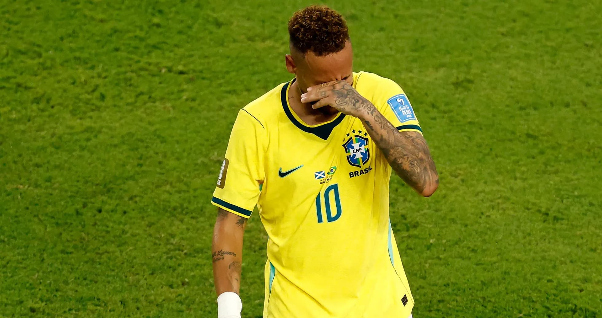 Player in Brazil jersey walking on field after match