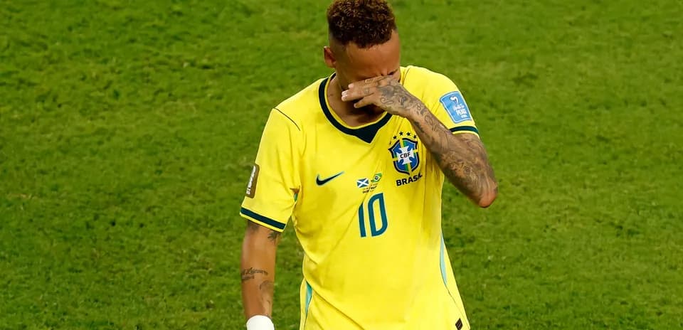 Player in Brazil jersey walking on field after match