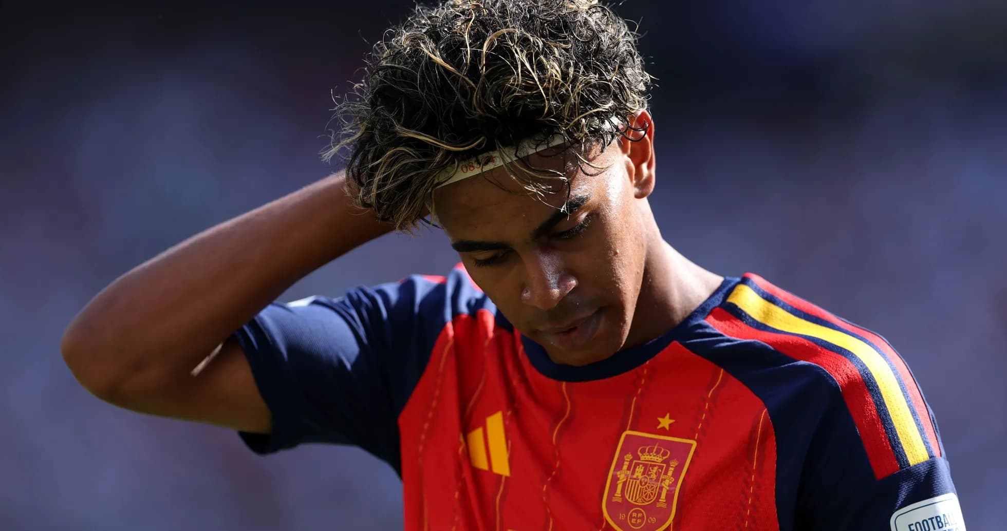 Player in Spain jersey looking down during match