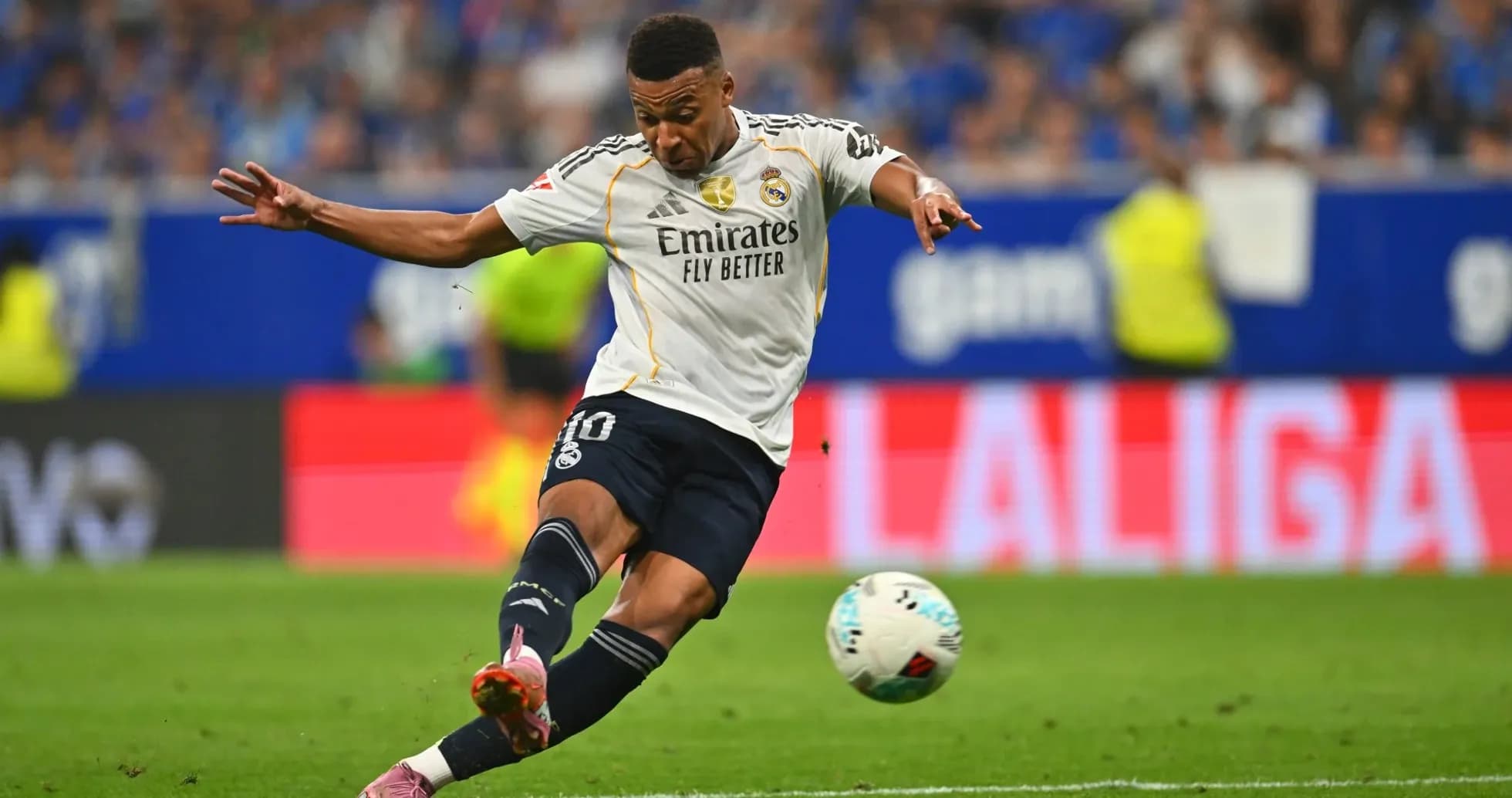Real Madrid player shooting the ball
